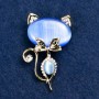 Brooch Kitty Cat's Eye blue color with white rhinestones 45x28 mm yellow metal