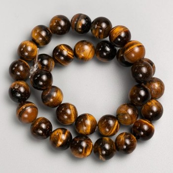 Beads on a fishing line of natural Tiger's Eye stone, diameter 12 mm, length 38 cm