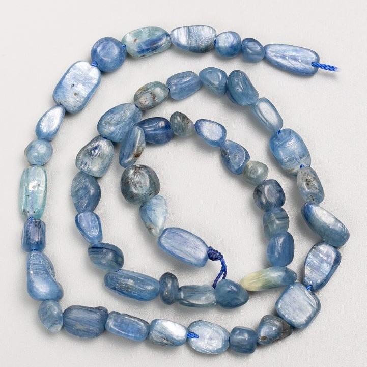 Natural kyanite beads on thread, with a tumbled finish, sizes 8x11–6x7 mm, length 40 cm