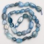 Beads on a thread of natural kyanite, tumbled, 10×12 mm, length 40 cm +/-