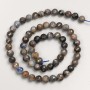 Beads of natural stone: Dichroite (iolite), faceted round bead on a thread, diameter 6.5 mm, length 39 cm