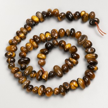 Beads of natural Tiger's Eye stone, strung on thread, diameter 11x5 mm, length 40 cm