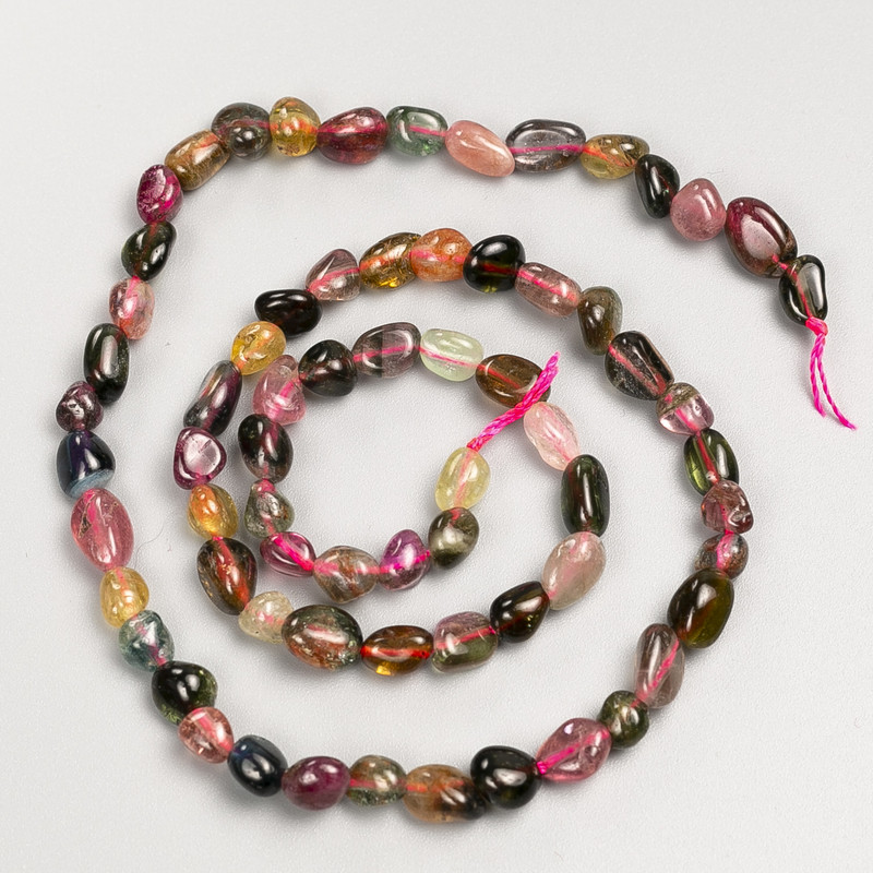 Beads of natural tourmaline stone, faceted, on a thread, diameter 5x7 mm, length 40 cm