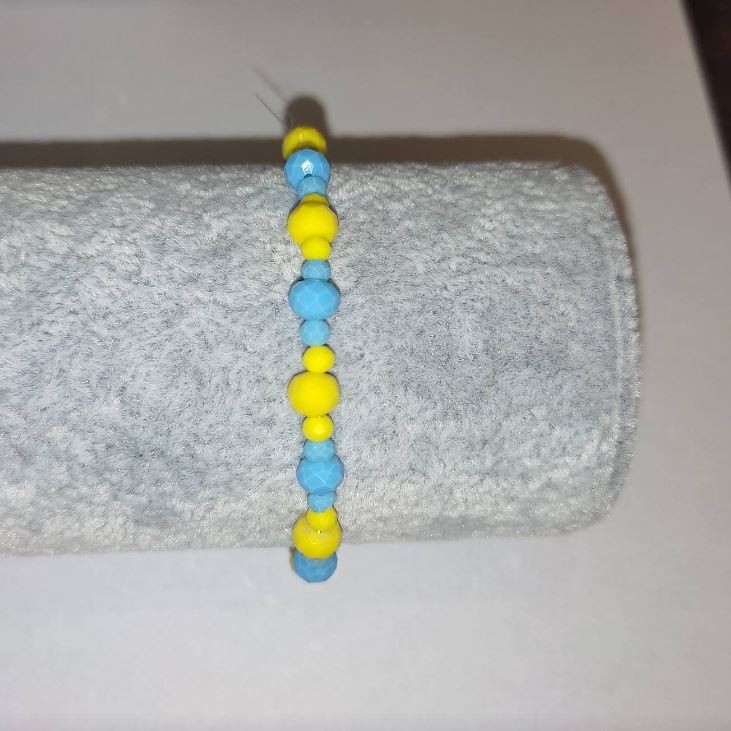 Bracelet 'Ukraine' with Czech crystal 'faceted rondelle' on elastic, diameter 6×4 mm ±, diameter 3×2 mm ±, length 18 cm ±