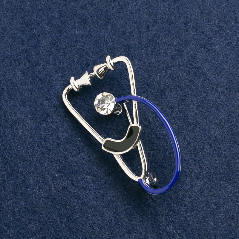 Brooch 'Stethoscope' enamel black and blue, with white stone, silver metal 43×24 mm
