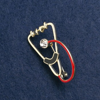 Brooch Stethoscope enamel red and black, with white stone, gold-toned metal 45x23mm
