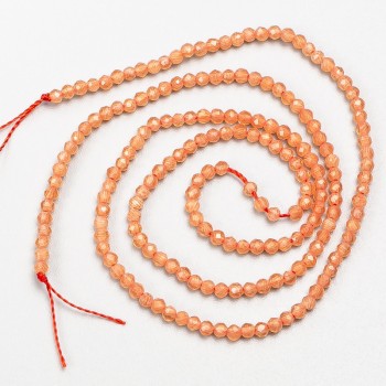 Small synthetic spinel beads, coral-colored faceted round beads, 2 mm diameter, on cord, length 37 cm