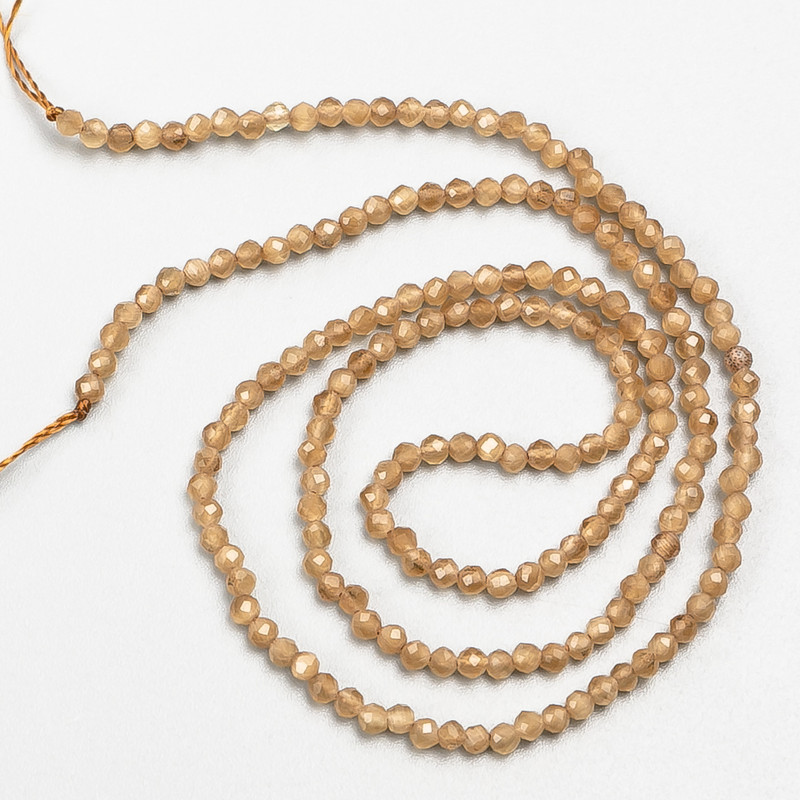 Small spinel beads (synthetic), light brown, faceted round beads, 2 mm diameter, on a thread, 37 cm length