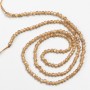 Small spinel beads (synthetic), light brown, faceted round beads, 2 mm diameter, on a thread, 37 cm length