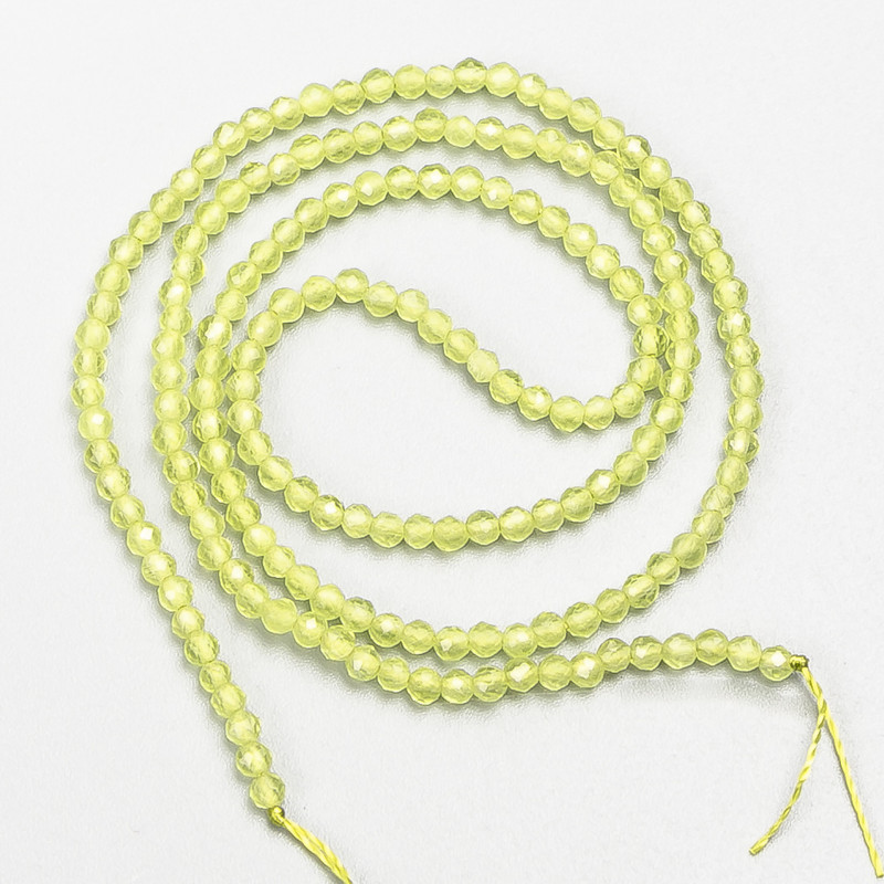 Small synthetic spinel beads, yellow lime, faceted spheres, 2 mm diameter, on a thread, length 37 cm