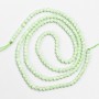 Small spinel beads (synthetic) pale-green faceted spheres, 2 mm diameter, on a thread, length 37 cm