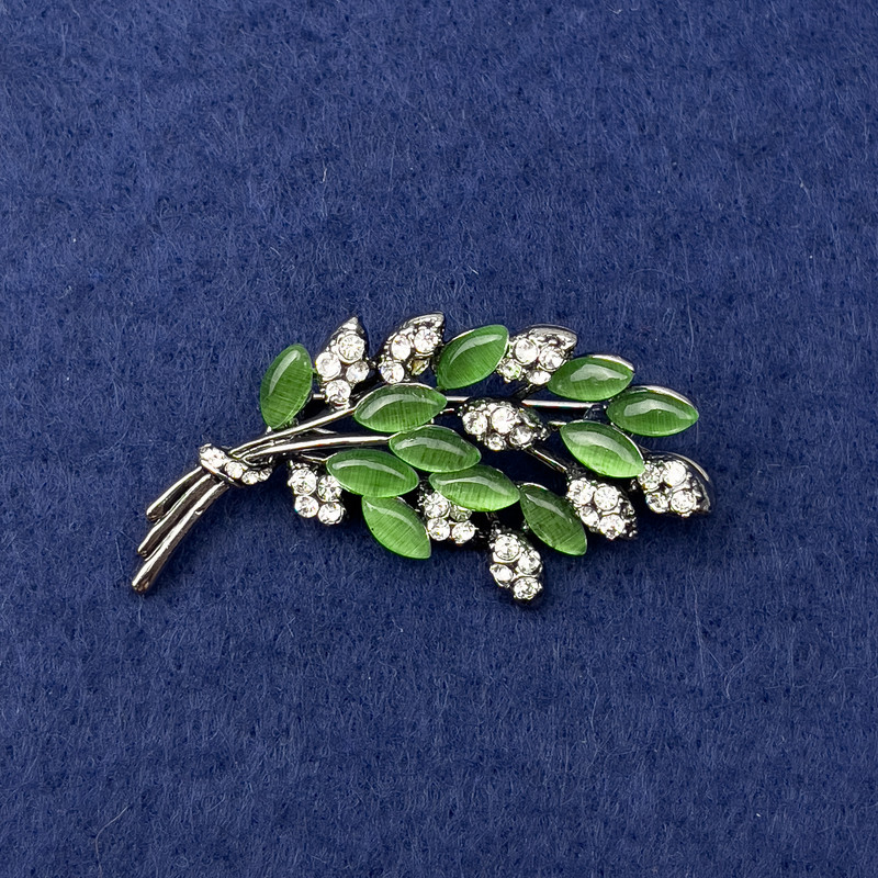 Brooch Twig with Green Cat's Eye, White Crystals, Silver Metal, diameter 50x27mm+