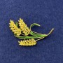 Brooch 'Wheat Ears' with yellow crystals, green enamel, gold-tone metal, diameter 56x35 mm+