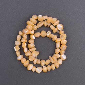 Beads, tinted peach mother-of-pearl, faceted, 8x6 mm diameter, 41 cm length on a thread