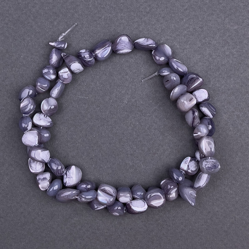 Gray-toned mother-of-pearl faceted beads, 8x6 mm, length approx. 41 cm on thread