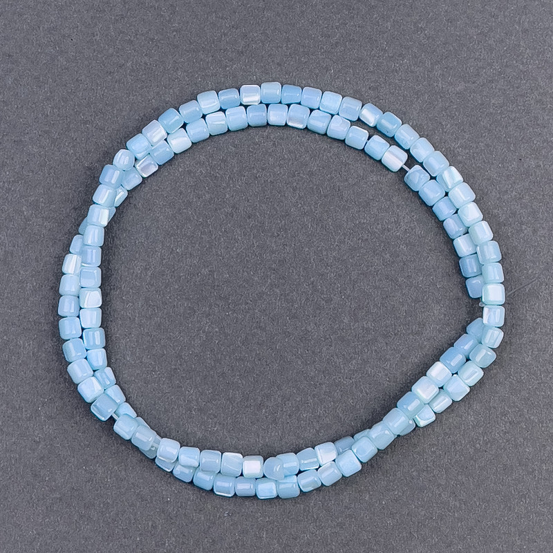 Beads of tinted blue mother-of-pearl, cylindrical, 3.5×3.5 mm, length 40 cm +/- on thread