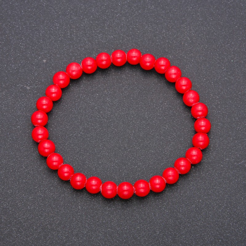 Bracelet made of natural coral pressed on elastic — smooth bead, diameter 6(±)mm, length 18cm