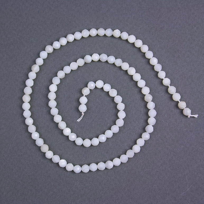 Natural mother-of-pearl beads - faceted ball, diameter 4 mm ±, on thread, length 38 cm+