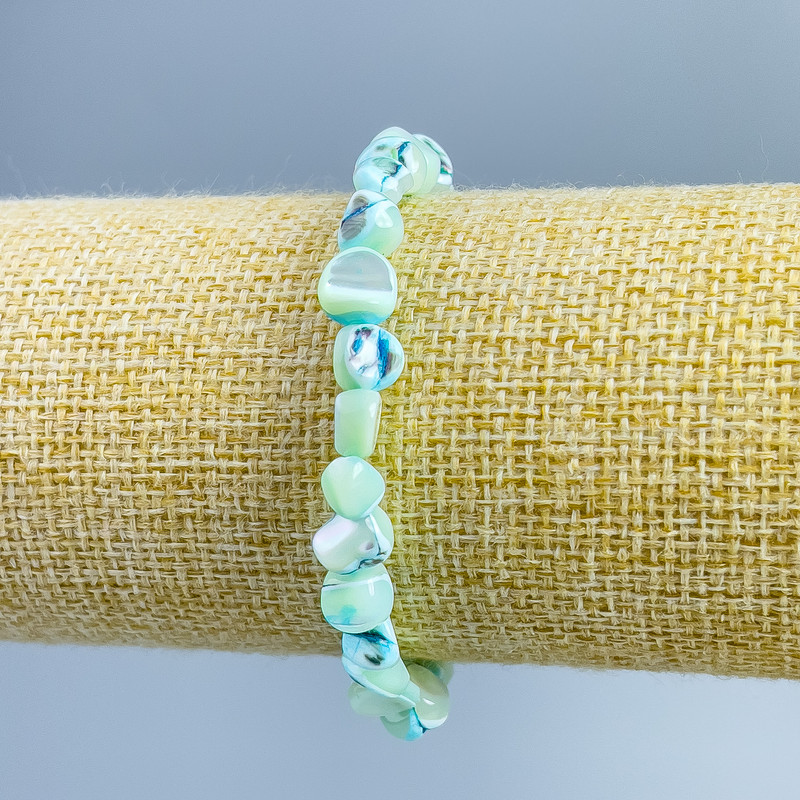 Bracelet with light-blue mother-of-pearl, faceted beads, diameter 8x6 mm, length 18 cm (stretch)