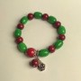 Bracelet with chrysoprase barrel beads, 10x14 mm diameter, and coral smooth round beads, 10 mm, 12 mm +/-, length 18 cm (stretch) with inserts