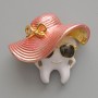 Brooch 'Tooth in a Hat' with white, pink, and black enamel, gold-tone metal 33×30mm