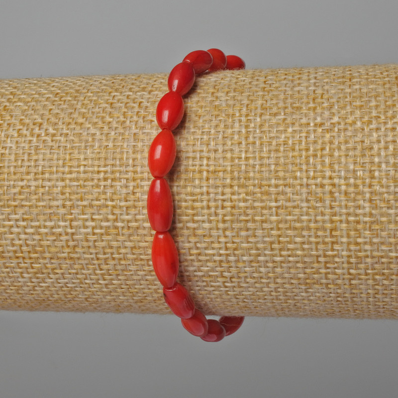 Bracelet with natural coral beads, 5×9 mm diameter, 18 cm long ± (stretch)
