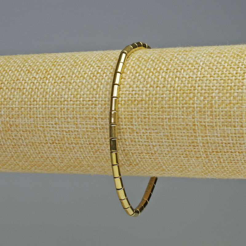 Hematite bracelet with cylindrical beads, gold color, 5×3 mm, length 18 cm, elastic