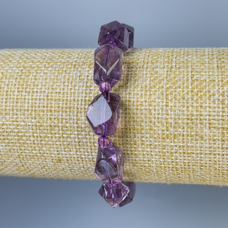 Amethyst bracelet with faceted beads 12-15 by 9-13 mm, length 18 cm, elastic