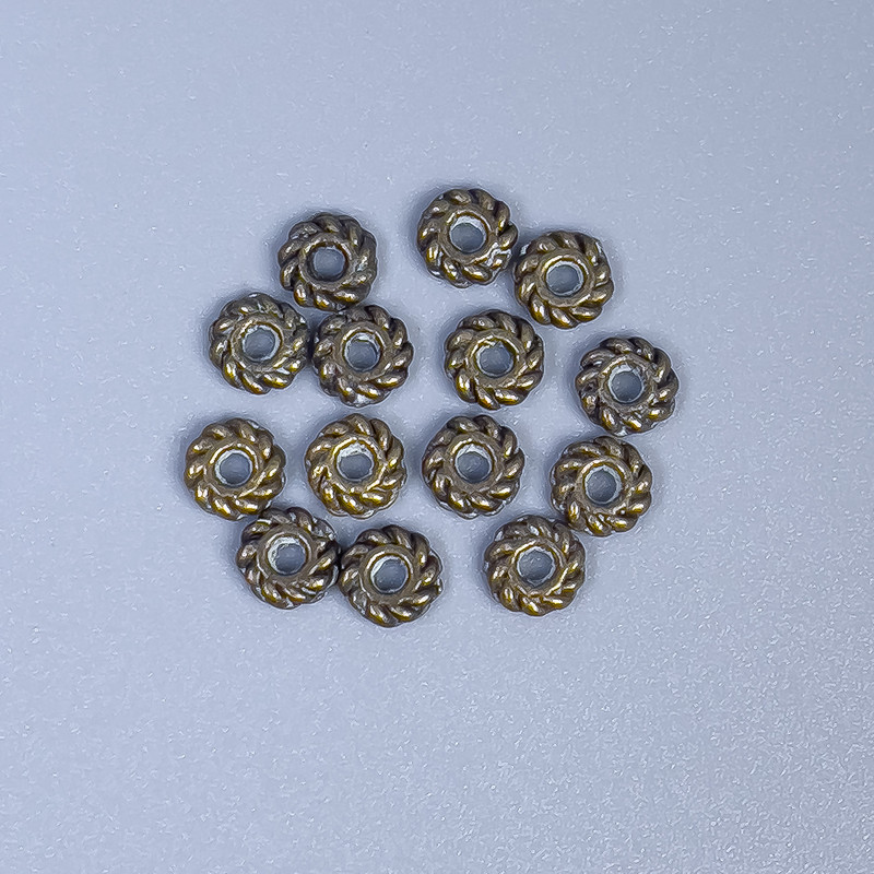 Bronze-colored bead insert finding, 4x1 mm diameter with approx. 1 mm hole, packaging 22 pcs