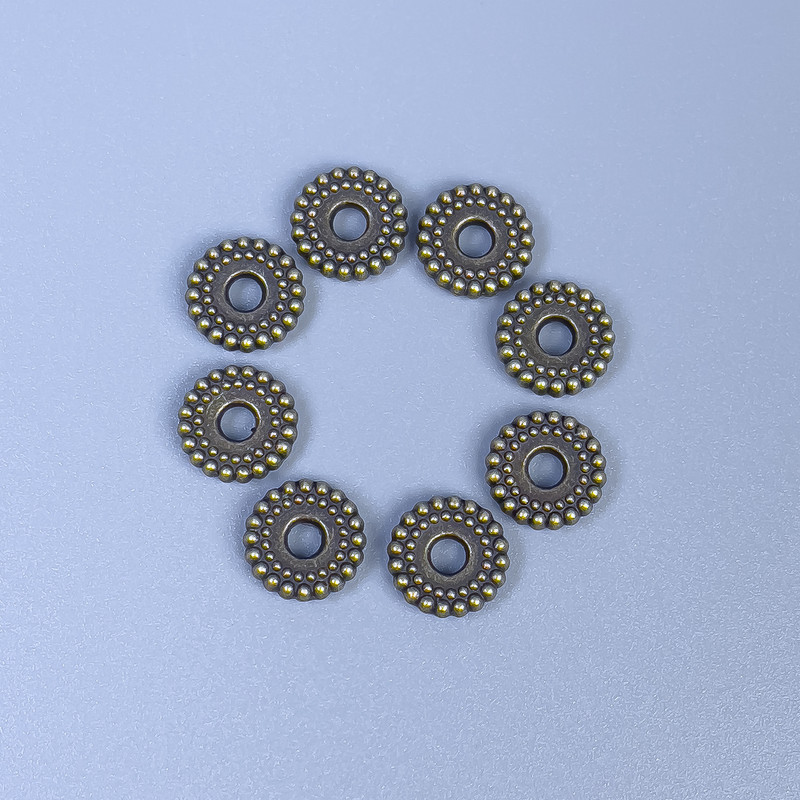 Bronze-colored bead-insert finding, 7.5×2 mm, with a 2.5 mm hole, packaging 20 g (~50 pcs)