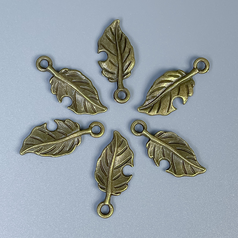Leaf Pendant Finding, Bronze Metal Color, Size 23x10x1mm ± Hole Diameter 2mm ± Packaging 20 g (~26 pcs)