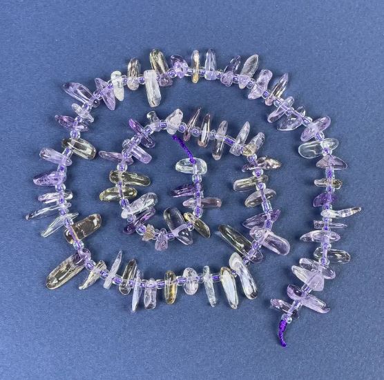 Amethyst chip beads 9–12×3–4 mm, with seed beads on thread, length 40 cm