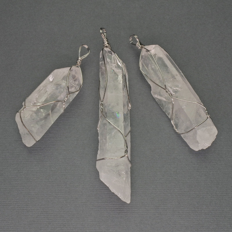 Pendant with rock crystal in a braided setting, 65x55x18 mm ± assorted size