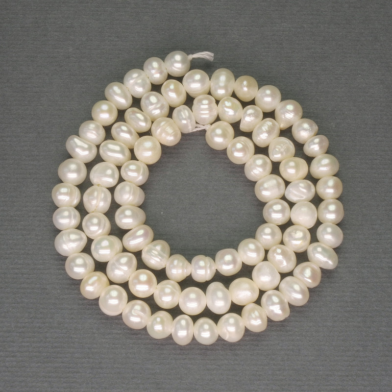 Freshwater white oval pearls on a thread, diameter 5x5-5.5 mm, length 35 cm+