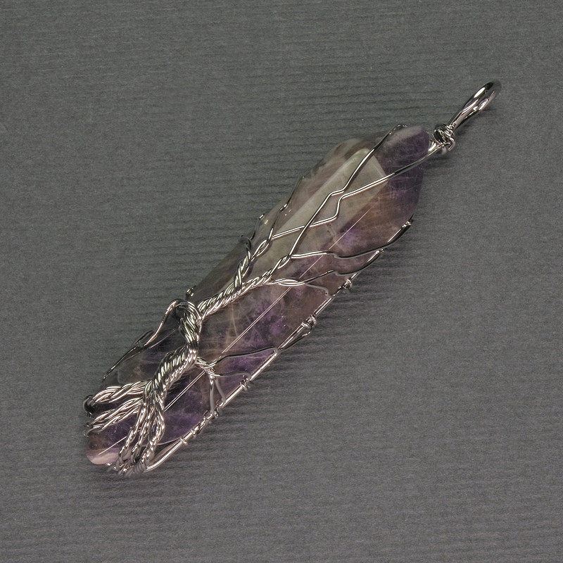 Amethyst Hexagonal Crystal Pendant 12 x 50 x 57 mm +/- in a Silver-Plated Weave