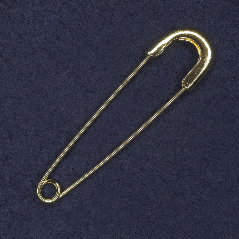 Gold-colored metal brooch-pin 20×77 mm