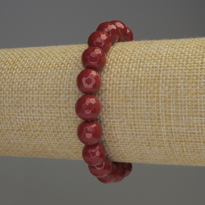Faceted coral bead bracelet, approximately 10 mm diameter, 18 cm stretch
