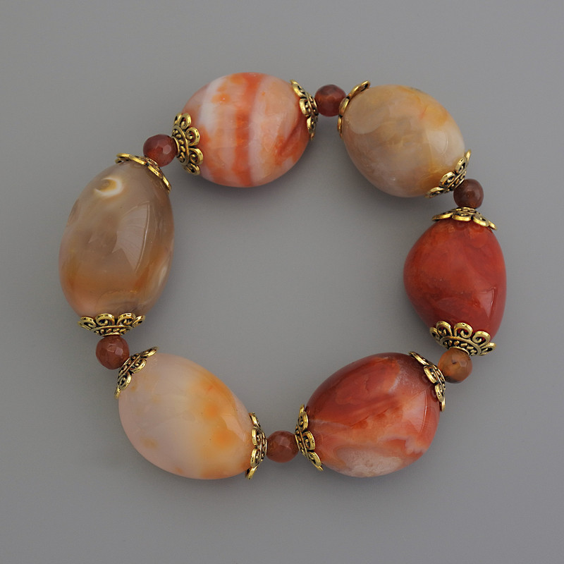 Clearance! Carnelian Bracelet with Faceted Beads, Oval 23x20 mm +/-; 6 mm faceted beads +/-; 18 cm stretch