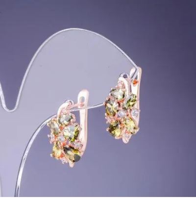 Earrings with green crystals 19×10 mm gold-toned metal