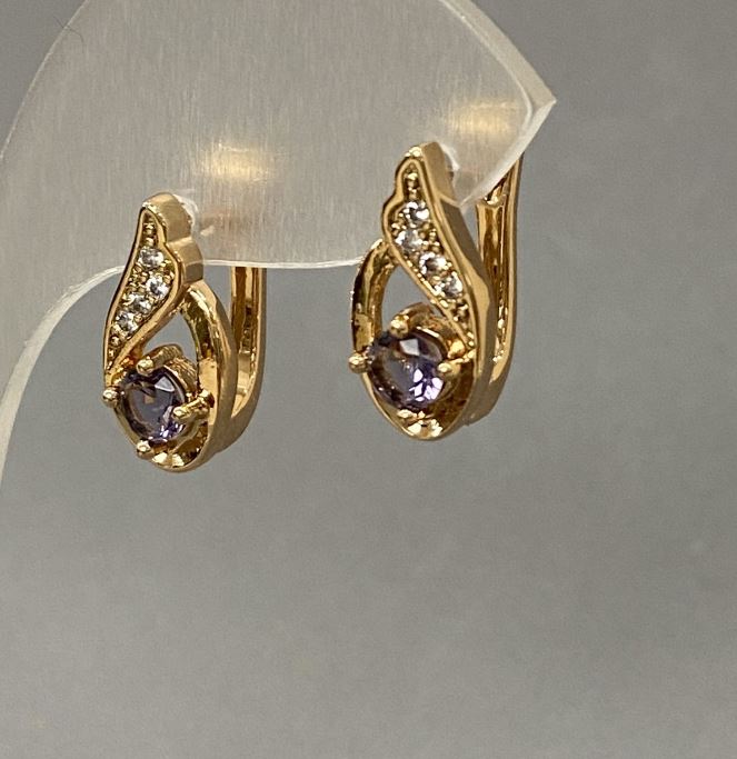 Earrings with purple crystals (16×7 mm) in golden metal