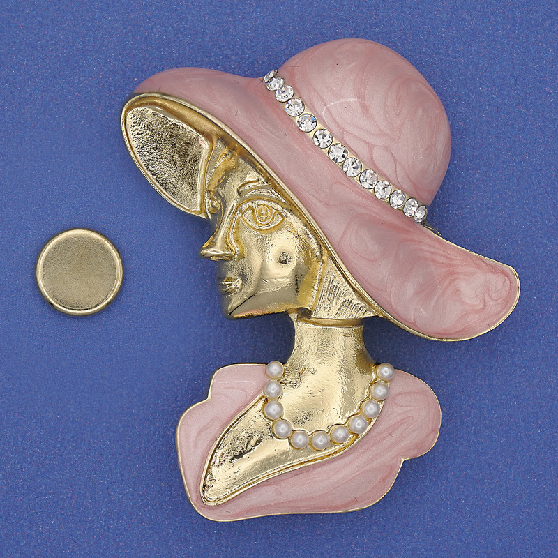 Magnetic brooch 'Girl in a Hat' with white crystals, pink enamel, golden metal 53x45mm+