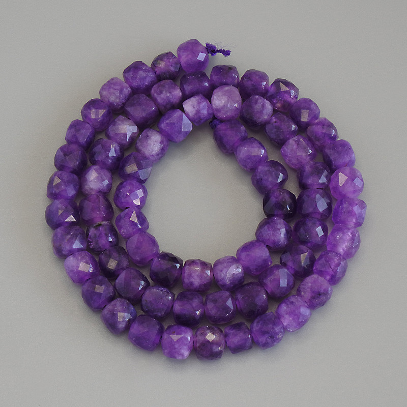 Sugilite beads faceted cubes, about 5.5 mm in diameter, on thread, length 37 cm