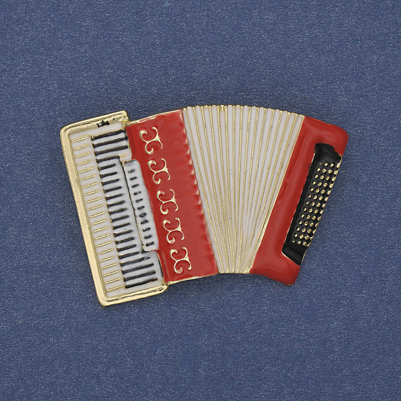 Brooch 'Accordion' red and white enamel gold-tone metal 43×28 mm+