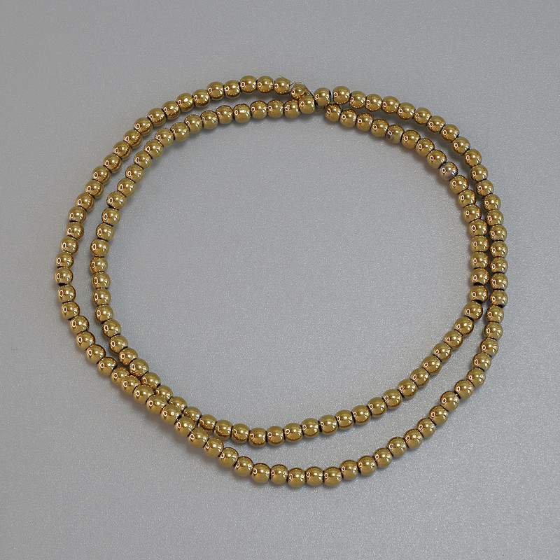 Gold-colored hematite beads, smooth 3mm round beads on a thread, length approximately 39 cm