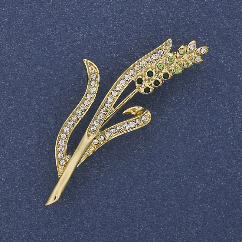 Brooch 'Wheat Ear' with green and white crystals on golden metal 20x53mm+
