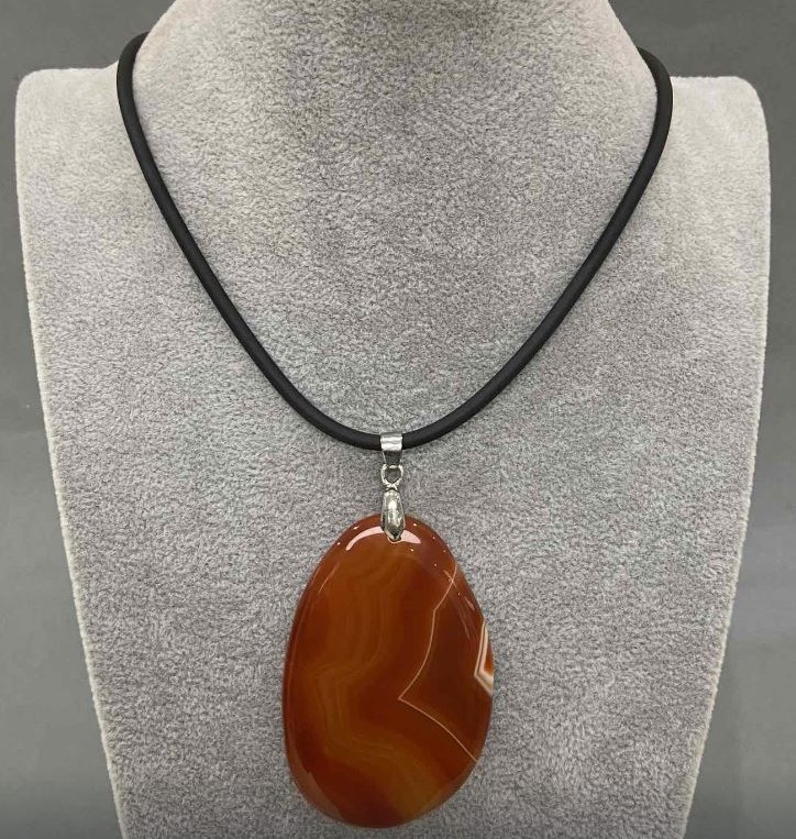 Sardonyx Pendant 57×40 mm +/- (assorted sizes) on a rubber cord, length 60 cm + 5 cm extension chain