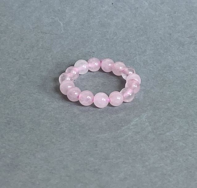 Bracelet with smooth rose quartz beads, 4 mm diameter, stretch cord