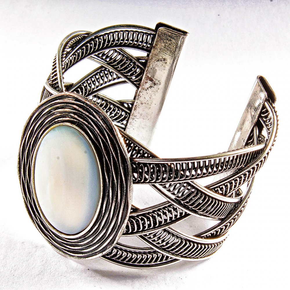 Wide pearl bracelet with metal bezel, oval setting