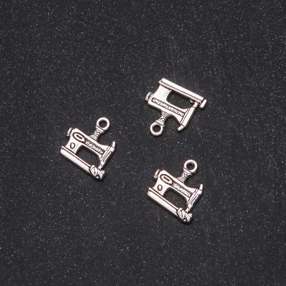 Pendant hardware Sewing machine 14x15mm packaging 20 g +/- 19 pcs