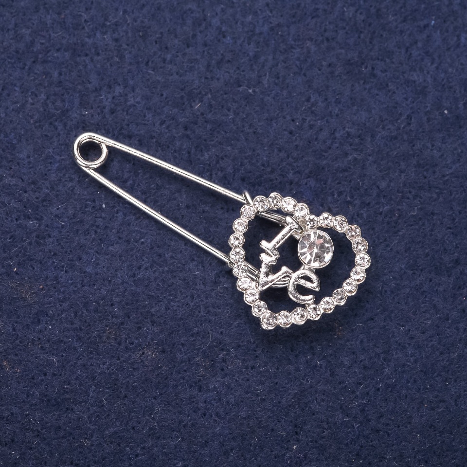 Brooch-pin 'Heart LOVE' with white crystals 43×18 mm silver-tone metal